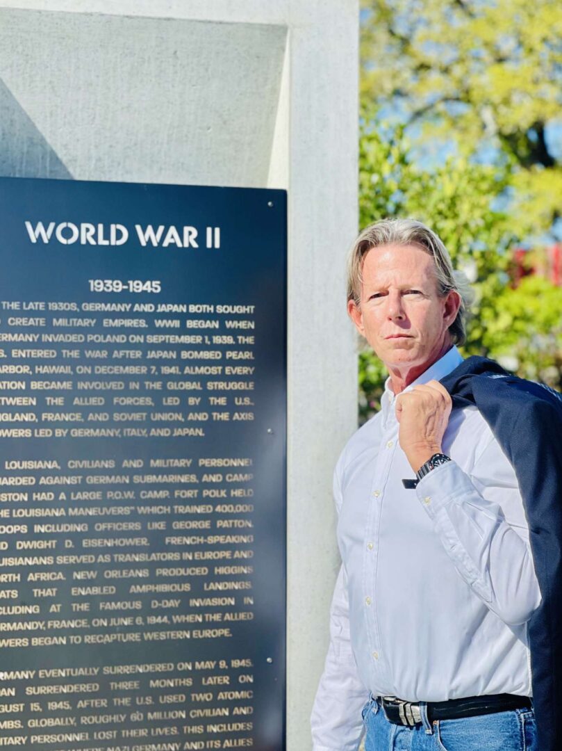 A Man Standing Beside a World War Two Stone